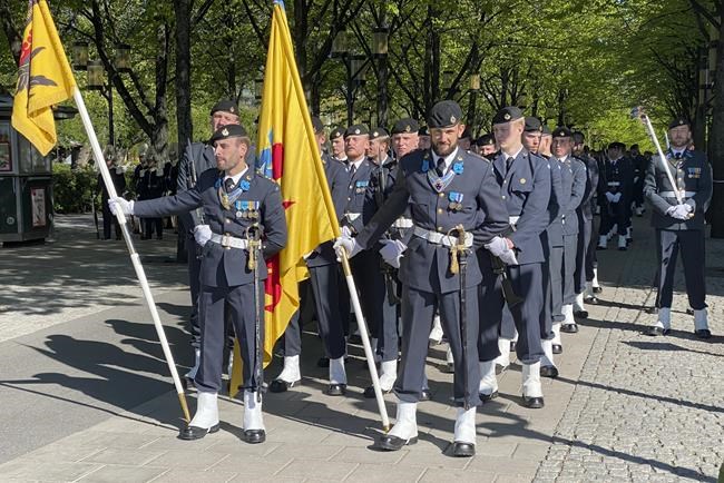 Soldiers from the Swedish Armed Forces stand in formation near the Royal Palace in Stockholm, Sweden, Tuesday, May 17, 2022. Sweden's decision to seek NATO membership follows a similar decision by neighboring Finland, a historic shift for the countries, which have been nonaligned for generations. (AP Photo/Karl Ritter)