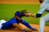 New York Mets' Starling Marte slides to third base during the first inning of a baseball game against the Seattle Mariners, Saturday, May 14, 2022, in New York. After review, Marte was called safe at third for a triple. (AP Photo/Frank Franklin II)