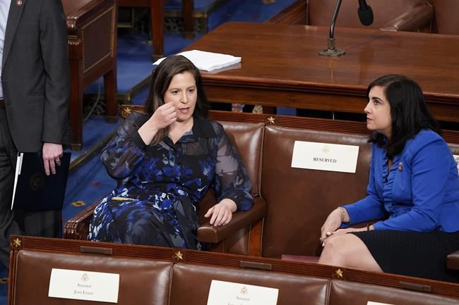 House Republican Conference Chair Elise Stefanik, R-N.Y., left, speaks with Rep. Nicole Malliotakis, R-N.Y., as they await a speech by Greek Prime Minister Kyriakos Mitsotakis to a joint meeting of Congress, at the Capitol in Washington, Tuesday, May 17, 2022. (AP Photo/J. Scott Applewhite)