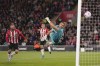 Southampton goalkeeper Alex McCarthy fails to stop a goal by Liverpool's Joel Matip, not pictured, during a Premier League soccer match at St Mary's Stadium, Southampton, England, Tuesday, May 17, 2022. (John Walton/PA via AP)
