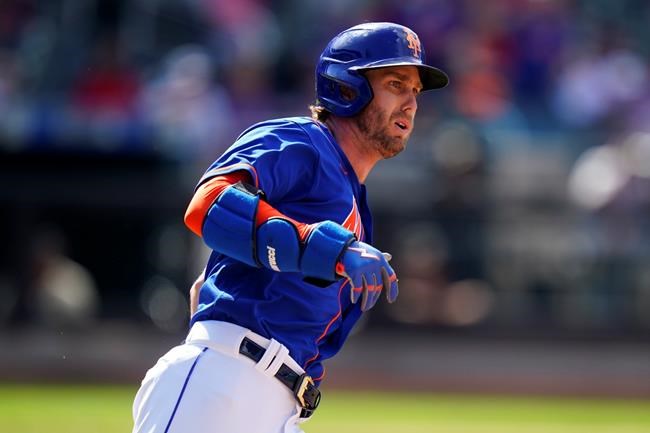 New York Mets' Jeff McNeil watches the ball he hit for an RBI double as he runs to second base during the third inning in the first baseball game of a doubleheader against the St. Louis Cardinals Tuesday, May 17, 2022, in New York. (AP Photo/Frank Franklin II)