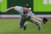 Seattle Mariners right fielder Steven Souza Jr. (21) dives to try to catch a triple by Toronto Blue Jays centre fielder George Springer (4) off starting pitcher Logan Gilbert (36) during second inning MLB action in Toronto on Tuesday May 17, 2022. THE CANADIAN PRESS/Frank Gunn