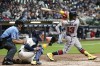 Atlanta Braves' Ronald Acuna Jr. hits an RBI single during the fifth inning of a baseball game against the Milwaukee Brewers Tuesday, May 17, 2022, in Milwaukee. (AP Photo/Morry Gash)
