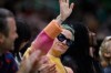 Soccer player Megan Rapinoe waves to the crowd during the second quarter of a WNBA basketball game between the Minnesota Lynx and the Seattle Storm on Friday, May 6, 2022, in Seattle. Rapinoe's fiancee, Sue Bird, plays for the Storm. (Jennifer Buchanan/The Seattle Times via AP)