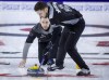 Team Wild Card One skip Brad Gushue, left, makes a shot as second Brett Gallant sweeps during finals action against Team Alberta at the Tim Hortons Brier in Lethbridge, Alta., Sunday, March 13, 2022. THE CANADIAN PRESS/Jeff McIntosh