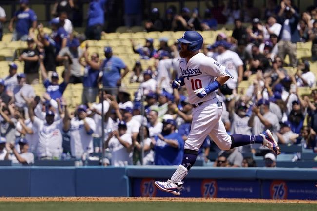 Los Angeles Dodgers' Justin Turner rounds first after hitting a three-run home run during the fourth inning of a baseball game against the Arizona Diamondbacks Wednesday, May 18, 2022, in Los Angeles. (AP Photo/Mark J. Terrill)