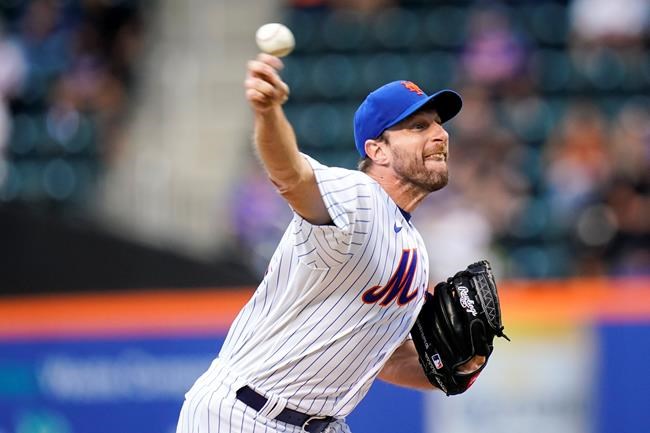 New York Mets' Max Scherzer pitches during the first inning of the team's baseball game against the St. Louis Cardinals on Wednesday, May 18, 2022, in New York. (AP Photo/Frank Franklin II)