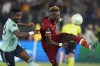 Roma's Tammy Abraham right, challenges for the ball with Leicester's Daniel Amartey during a Conference League semifinal second leg soccer match between Roma and Leicester City, at Rome's Olympic Stadium, Thursday, May 5, 2022. (AP Photo/Andrew Medichini)