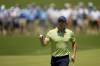 Rory McIlroy, of North Ireland, waves after making a putt on the first hole during the first round of the PGA Championship golf tournament, Thursday, May 19, 2022, in Tulsa, Okla. (AP Photo/Sue Ogrocki)