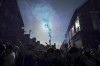 Everton fans use flares outside of the stadium before the English Premier League soccer match between Everton and Crystal Palace at Goodison Park in Liverpool, England, Thursday, May 19, 2022. (AP Photo/Jon Super)