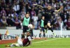 Burnley's Josh Brownhill, right, and Aston Villa's Douglas Luiz battle for the ball during the English Premier League soccer match between Aston Villa and Burnley at Villa Park, Birmingham, England, Thursday May 19, 2022. (Mike Egerton/PA via AP)