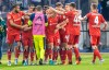 Ludovit Reis of Hamburger SV, second left, celebrates scoring with teammates during the Bundesliga relegation play off soccer match between Hertha BSC and Hamburger SV at Olympiastadion in Berlin, Thursday May 19, 2022. (Andreas Gora/dpa via AP)