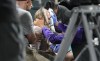 Colorado Rockies television reporter Kelsey Wingert is attended to after being hit by a foul ball off the bat of San Francisco Giants' Austin Slater in the ninth inning of a baseball game Monday, May 16, 2022, in Denver. The announcer, who was seated in the first-base camera well, was taken from the game after being struck in the head by the ball. (AP Photo/David Zalubowski)
