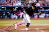 Arizona Diamondbacks' Jose Herrera watches the flight of his two-run double against the Colorado Rockies in the second inning of a baseball game Sunday, May 8, 2022, in Phoenix. (AP Photo/Ross D. Franklin)