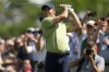Rory McIlroy, of Northern Ireland, hits from the fairway on the 18th hole during the first round of the PGA Championship golf tournament Thursday, May 19, 2022, in Tulsa, Okla. (AP Photo/Eric Gay)