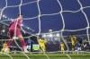 Everton's Dominic Calvert-Lewin, right, scores against Christal Palace during the English Premier League soccer match between Everton and Crystal Palace at Goodison Park in Liverpool, England, Thursday, May 19, 2022. (AP Photo/Jon Super)