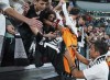 Juventus's Paulo Dybala signs autographs after the Serie A soccer match between Juventus and Lazio at Allianz Stadium, Turin, Italy, Monday May 16, 2022. (Spada/LaPresse via AP)
