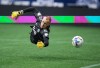 Vancouver Whitecaps goalkeeper Cody Cropper dives for a San Jose Earthquakes shot that went wide of the goal during the first half of an MLS soccer game in Vancouver, on Saturday, May 14, 2022. THE CANADIAN PRESS/Darryl Dyck