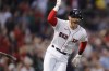 Boston Red Sox's Trevor Story head to first on his grand slam during the third inning of the team's baseball game against the Seattle Mariners, Friday, May 20, 2022, in Boston. (AP Photo/Michael Dwyer)