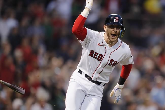 Boston Red Sox's Trevor Story head to first on his grand slam during the third inning of the team's baseball game against the Seattle Mariners, Friday, May 20, 2022, in Boston. (AP Photo/Michael Dwyer)