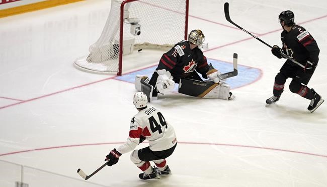 Pius Suter from Switzerland scores his side's 5th goal during the group A Hockey World Championship match between Canada and Switzerland in Helsinki, Finland, Saturday, May 21 2022. Switzerland defeated Canada 6-3 on Saturday at the world hockey championship. THE CANADIAN PRESS/AP-Martin Meissner
