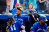 Toronto Blue Jays shortstop Bo Bichette (11) celebrates his two run home run, his second homer of the game, with teammate Lourdes Gurriel Jr. (13) during seventh inning MLB interleague baseball action against the Cincinnati Reds, in Toronto, Saturday, May 21, 2022. THE CANADIAN PRESS/Frank Gunn