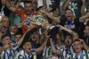 Panathinaikos players celebrate with the trophy after the Greek Cup Final soccer match between Panathinaikos and PAOK at the Olympic stadium in Athens, Greece, Saturday, May 21, 2022. Panathinaikos won 1-0. (AP Photo/Thanassis Stavrakis)