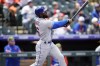 New York Mets' Starlin Marte follows the flight of his two-run home run off Colorado Rockies starting pitcher German Marquez in the first inning during the first baseball game of a doubleheader, Saturday, May 21 2022, in Denver. (AP Photo/David Zalubowski)