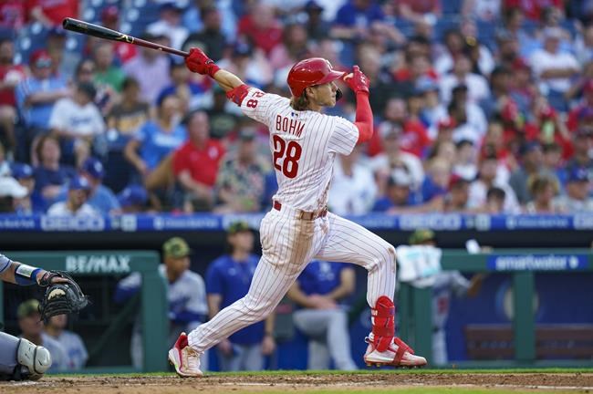 Philadelphia Phillies' Alec Bohm hits a two-run home run during the third inning of a baseball game against the Los Angeles Dodgers, Saturday, May 21, 2022, in Philadelphia. (AP Photo/Chris Szagola)
