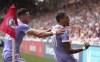 Leeds United's Raphinha, right, celebrates with teammate Jack Harrison after scoring their side's first goal of the game from the penalty spot, during the English Premier League soccer match between Brentford and Leeds United, at the Brentford Community Stadium, in London, Sunday, May 22, 2022. (John Walton/PA via AP)