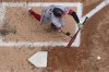 Washington Nationals' Cesar Hernandez bunts for an RBI single during the fourth inning of a baseball game against the Milwaukee Brewers Sunday, May 22, 2022, in Milwaukee. (AP Photo/Morry Gash)
