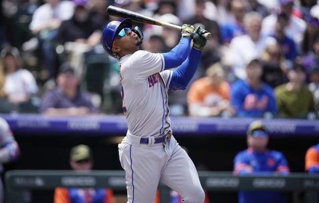 New York Mets' Francisco Lindor fouls off a pitch from Colorado Rockies starting pitcher Austin Gomber in the first inning of a baseball game Sunday, May 22, 2022, in Denver. (AP Photo/David Zalubowski)