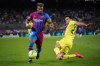 Barcelona's Adama Traore faces Villarreal's Alfonso Pedraza during a Spanish La Liga soccer match between Barcelona and Villarreal at the Camp Nou stadium in Barcelona, Spain, Sunday, May 22, 2022. (AP Photo/Joan Mateu Parra)