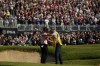 Justin Thomas celebrates with his caddie Jim 