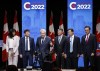 Candidates, left to right, Leslyn Lewis, Roman Baber, Jean Charest, Scott Aitchison, Patrick Brown, and Pierre Poilievre pose on stage following the Conservative Party of Canada English leadership debate in Edmonton, on May 11, 2022. The candidates will meet north of Montreal Wednesday to face off in the French debate. THE CANADIAN PRESS/Jeff McIntosh