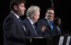 Conservative leadership candidate Pierre Poilievre gestures towards Jean Charest as Roman Baber, left, Scott Aitchison and Leslyn Lewis, right, look on during a debate at the Canada Strong and Free Network conference, in Ottawa, Thursday, May 5, 2022. THE CANADIAN PRESS/Adrian Wyld