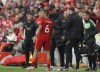 Liverpool's manager Jurgen Klopp talks to Liverpool's Thiago during the Premier League soccer match between Liverpool and Wolverhampton at Anfield stadium in Liverpool, England, Sunday, May 22, 2022. (AP Photo/Jon Super)