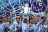 Manchester City players celebrate with trophy after winning the 2022 English Premier League title at the Etihad Stadium in Manchester, England, Sunday, May 22, 2022. (AP Photo/Dave Thompson)