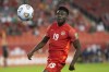 Canada's Alphonso Davies eyes the ball against Panama during second half World Cup qualifying action in Toronto on Wednesday, October 13, 2021. THE CANADIAN PRESS/Chris Young