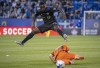 CF Montreal defender Zachary Brault-Guillard leaps over Forge FC midfielder Noah Jensen during second half Canadian Championship quarterfinal action in Montreal on Wednesday, May 25, 2022. THE CANADIAN PRESS/Paul Chiasson