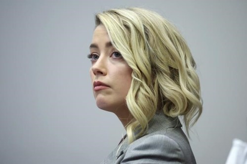 Actor Amber Heard appears in the courtroom in the Fairfax County Circuit Courthouse in Fairfax, Va., Thursday, May 26, 2022. Actor Johnny Depp sued his ex-wife Amber Heard for libel in Fairfax County Circuit Court after she wrote an op-ed piece in The Washington Post in 2018 referring to herself as a 