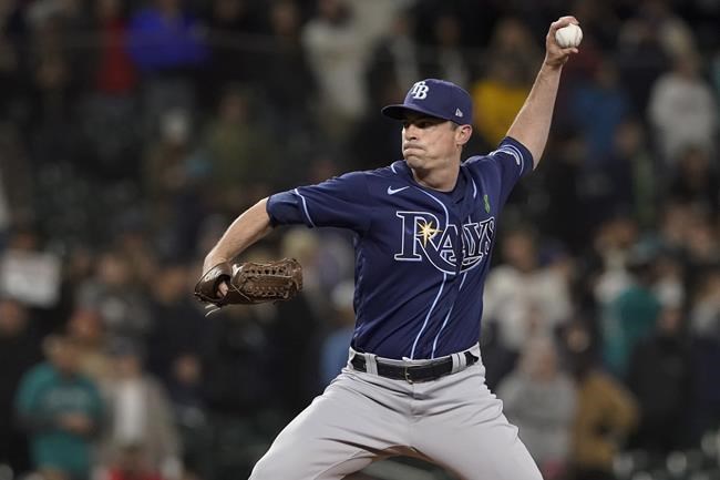 FILE - Tampa Bay Rays closing pitcher Brooks Raley throws to a Seattle Mariners batter during the ninth inning of a baseball game Thursday, May 5, 2022, in Seattle. The mass school shooting in Uvalde, Texas, was especially disturbing for Rays pitcher Brooks Raley. Uvalde is the 33-year-old left-hander’s hometown. (AP Photo/Ted S. Warren, File)