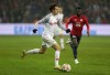 FILE - Salzburg's Brenden Aaronson runs with the ball during the Champions League group G soccer match between OSC Lille and RB Salzburg in Lille, France, Tuesday, Nov. 23, 2021. American midfielder Brenden Aaronson will transfer to Leeds on July 1 following 1 1/2 seasons with Red Bull Salzburg. Leeds said Thursday, May 26, 2022, that it had agreed to a transfer with the Austrian club. Aaronson, a 21-year-old from Medford, New Jersey, will have a five-year contract through the 2026-27 season.(AP Photo/Michel Spingler, File)