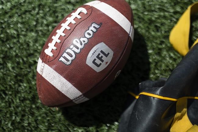 CFL football seen during the Hamilton Tiger-Cats opening day training camp at Ron Joyce Stadium in Hamilton, Ont., Thursday, May 19, 2022. The CFL and CFL Players’ Association have reached another tentative agreement. THE CANADIAN PRESS/Nick Iwanyshyn