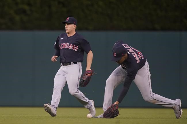 Cleveland Guardians right fielder Oscar Gonzalez plays the single hit by Detroit Tigers designated hitter Miguel Cabrera during the fourth inning of a baseball game, Thursday, May 26, 2022, in Detroit. (AP Photo/Carlos Osorio)