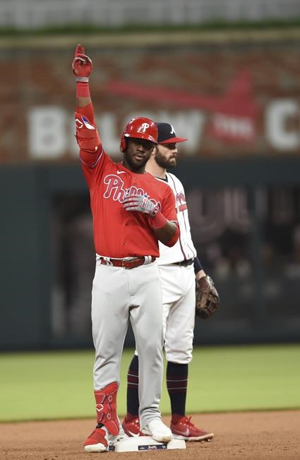 Philadelphia Phillies' Odubel Herrera (37) gestures after hitting a two-run double against the Atlanta Braves during the seventh inning of a baseball game Thursday, May 26, 2022, in Atlanta. (AP Photo/Hakim Wright Sr.)