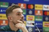 Liverpool's Jordan Henderson pauses during a press conference ahead of the Champions League final at the training centre in Liverpool, England, Wednesday, May 25, 2022. Liverpool will face Real Madrid in the Champions League final in Paris, France, on Saturday May 28,2022.(AP Photo/Jon Super)
