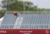 Sandy Wagner, of Knox, Ind., braves the rain and cool temperatures during the second round of the Senior PGA Championship golf tournament Friday, May 27, 2022, at Harbor Shores in Benton Harbor, Mich. (Don Campbell/The Herald-Palladium via AP)