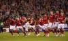 Nottingham Forest players celebrate after defeating Sheffield United in a penalty kick shootout in a Sky Bet Championship play-off semi-final, second leg soccer match at the City Ground, Nottingham, England, Tuesday May 17, 2022. (Zac Goodwin/PA via AP)