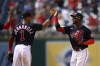 Washington Nationals' Victor Robles, right, celebrates with Cesar Hernandez (1) after the first baseball game of a doubleheader against the Colorado Rockies, Saturday, May 28, 2022, in Washington. The Nationals won 13-7. (AP Photo/Nick Wass)